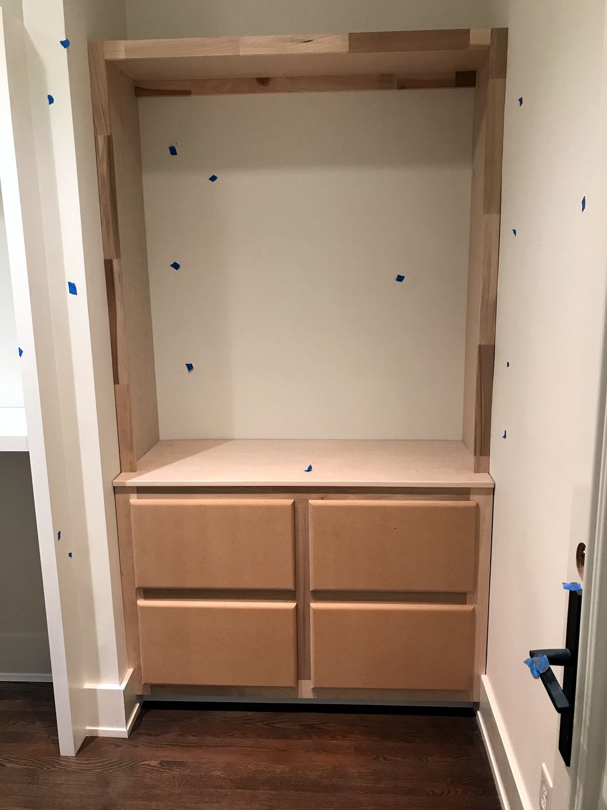 Built-in unit being fitted in place before finishing