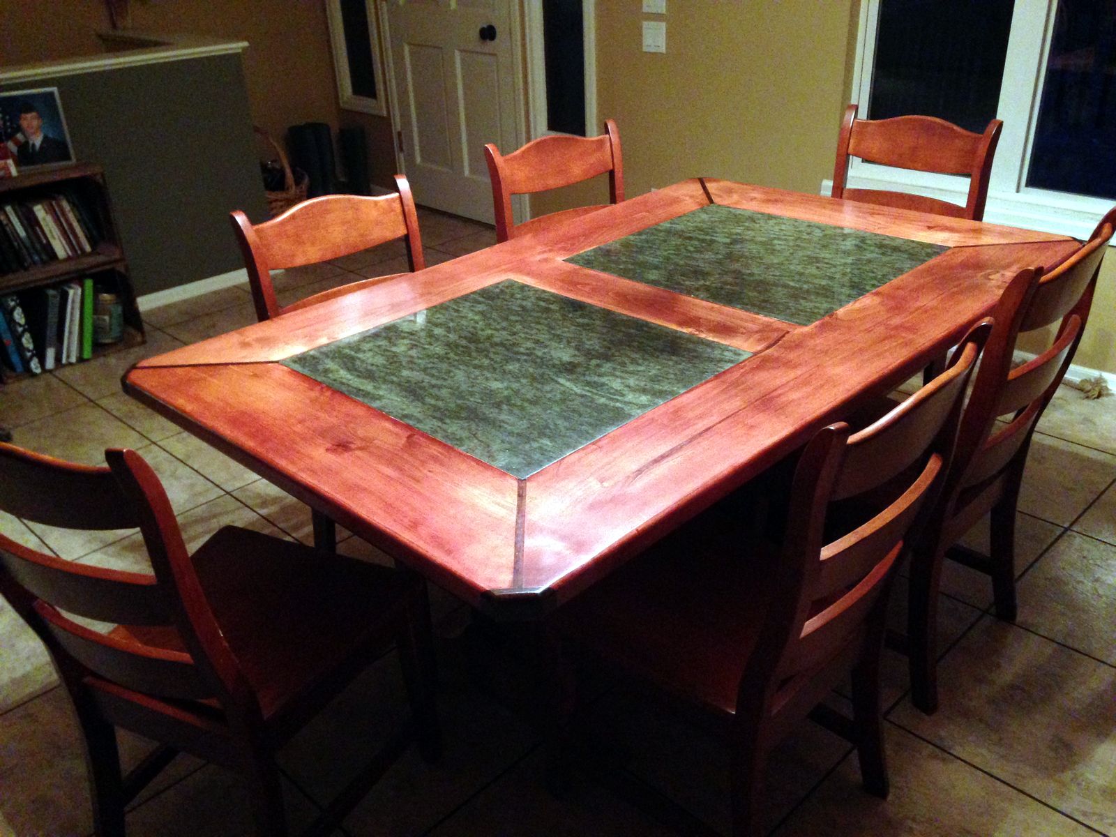 Dining table with inset stone panels