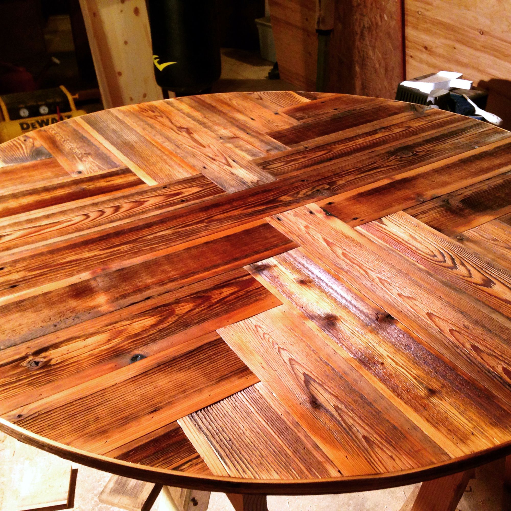 Round tabletop made of reclaimed wood planks
